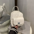 Mini white quilted backpack with silver chain strap and metallic twist-lock detail - White