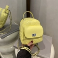 Mini quilted yellow leather backpack with chain strap and silver twist-lock closure - Yellow