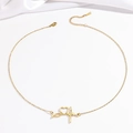 Elegant gold heartbeat necklace with heart pendant on white silk fabric background - Gold