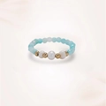Close-up of handmade ring with blue faceted beads, gold accents and white pearls - Three Pearls (J0398)
