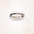 Detailed macro of a beaded ring featuring a natural pearl and multi-colored faceted stones - Tourmaline Freshwater Pearl (J0392)
