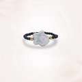 Macro detail of baroque pearl ring with black spinel beads and gold metal accents - Baroque Pearl Style