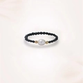 Detailed view of beaded ring with black faceted stones, white pearl and gold accents - Freshwater Pearl Style
