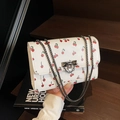 White cherry print crossbody bag with chain strap and metallic twist lock for women - Off White