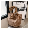 Detail of hand-woven tote bag with thick rope handles and fringe decorative knots - Khaki