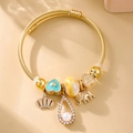 Elegant gold twisted wire charm bracelet with blue heart and elephant pendants - Gold Style 010