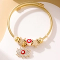 Elegant gold twisted wire bangle with evil eye charms and a rhinestone pendant - Gold Style 009