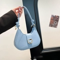 Minimalist light blue baguette bag with golden horseshoe buckle and knotted shoulder strap - Blue