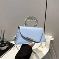 Sky blue geometric handbag with silver metal ring handle and gold trim detail - Blue