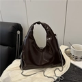Dark brown patent leather hobo bag with shiny finish and delicate silver metal chain - Brown