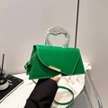 Green leather handbag with unique silver metal handle and stylish asymmetrical flap - Green