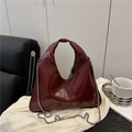 Glossy burgundy leather handbag with silver chain strap for a minimalist summer style - Red