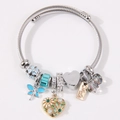 Pulsera de moda con dijes de libélula y corazón, cuentas azules y tejido de acero - Azul lago