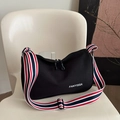Minimalist black lightweight crossbody bag with a red, white, and blue striped strap - Black
