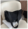 Detail of black nylon crescent bag with adjustable wide strap and logo badge - Black