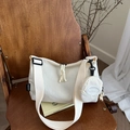 Minimalist beige corduroy dumpling bag with adjustable wide strap and round coin purse - White