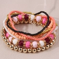 Detail view of Bohemian multi-layer beaded bracelet set with gold and colorful beads - Pink