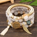 4-piece Bohemian multilayer beaded bracelet set with wing charms and silk tassels - White