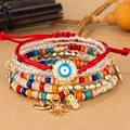 Bohemian multi-layer beaded bracelet set with Hamsa hand and Evil Eye charms - 6-Piece Set / Mixed Red