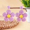 Bohemian purple and yellow woven petal earrings hanging on a natural wooden branch - Purple Flower Style / Purple
