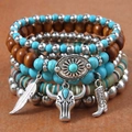 Bohemian multilayer beaded bracelet set with turquoise beads, feather and cow skull charms - Multi-layer Turquoise Wood Bead Set