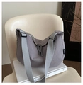 Detail of grey oxford nylon crossbody bag with dual zipper and textured crescent design - Gray