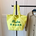 Minimalist yellow canvas tote bag with green Aloha print and durable double handles - Yellow