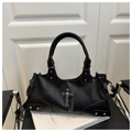Close-up of black gothic tote bag featuring silver metal cross and punk rivet detailing - Black