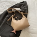 Minimalist beige moon-shaped faux leather shoulder bag with decorative vertical stitching - Khaki