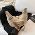 Chic cream-colored hobo bag with adjustable shoulder strap and textured fabric - Khaki