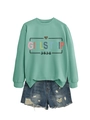 Detail of mint green sweatshirt with Girls Trip 2026 print and distressed denim shorts - S / Light Green Top And Blue Shorts