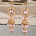 Detail of bohemian gold drop earrings featuring pink stones and tiered bead tassels - Pink
