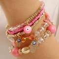 Bohemian multi-layer beaded bracelet set featuring pink resin beads and Hamsa Hand charm - Pink