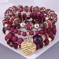 Bohemian multi-layer beaded bracelet with burgundy charms and gold heart pendant - Dark Purple
