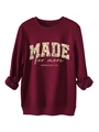 Close-up of burgundy sweatshirt showing floral filled MADE text and ribbing details - S / Burgundy