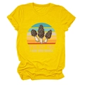Detail of mushroom print and Trust Me I Have Good Morels text on yellow t-shirt - S / Yellow