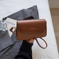 Brown patchwork crossbody bag featuring smooth PU leather and woven texture detail - Brown