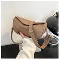 Close-up of khaki half-moon bag featuring textured faux leather and gold buckle detail - Khaki