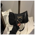 Detail of a vintage black leather underarm bag with a golden butterfly metal clasp - Black