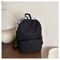Black minimalist travel backpack featuring a white PINK logo print and side mesh pocket - Black