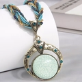 Bohemian woven bead necklace with a vintage turquoise pendant in a gold finish - Light Blue