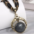 Bohemian choker necklace featuring a vintage round marble pendant and black braided bead cord - Black