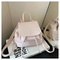 Detail of light pink mini faux leather backpack with drawstring closure and logo - Pink