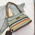 Colorful striped woven bucket bag with brown leather straps and fashion label tag - Rainbow