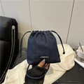 Minimalist dark blue denim drawstring bucket bag with silver logo for daily casual use - Dark Blue