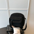 Minimalist black corduroy crossbody bag with woven zipper puller and wide strap - Black