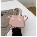 Pink woven mini crossbody bag with leather trim and top handle in a compact design - Pink