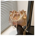 Detail of pink satin bucket bag featuring gold floral embroidery and pearl handle accent - Pink Large Flower