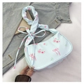 Detail of light blue floral handbag with pink rose prints and bow ribbon shoulder strap - Light Blue