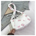 Detail of floral shoulder bag with pink roses, ribbon print and scrunchie strap - White